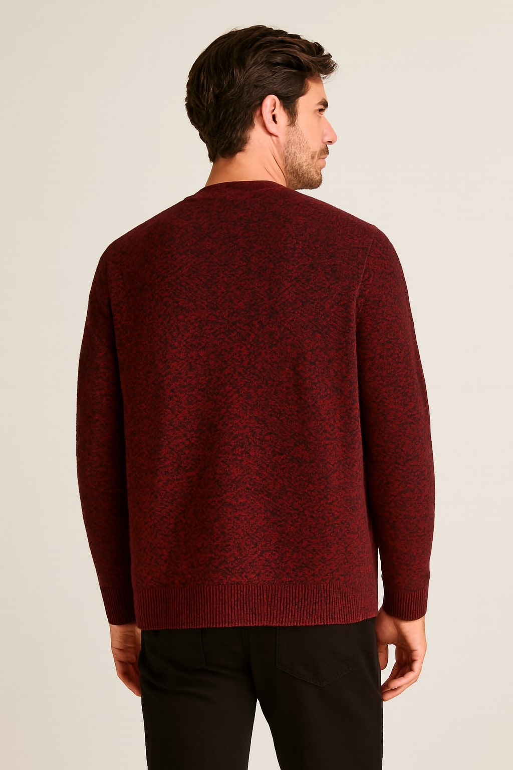 Back view of the men's button up cardigan in red on a model