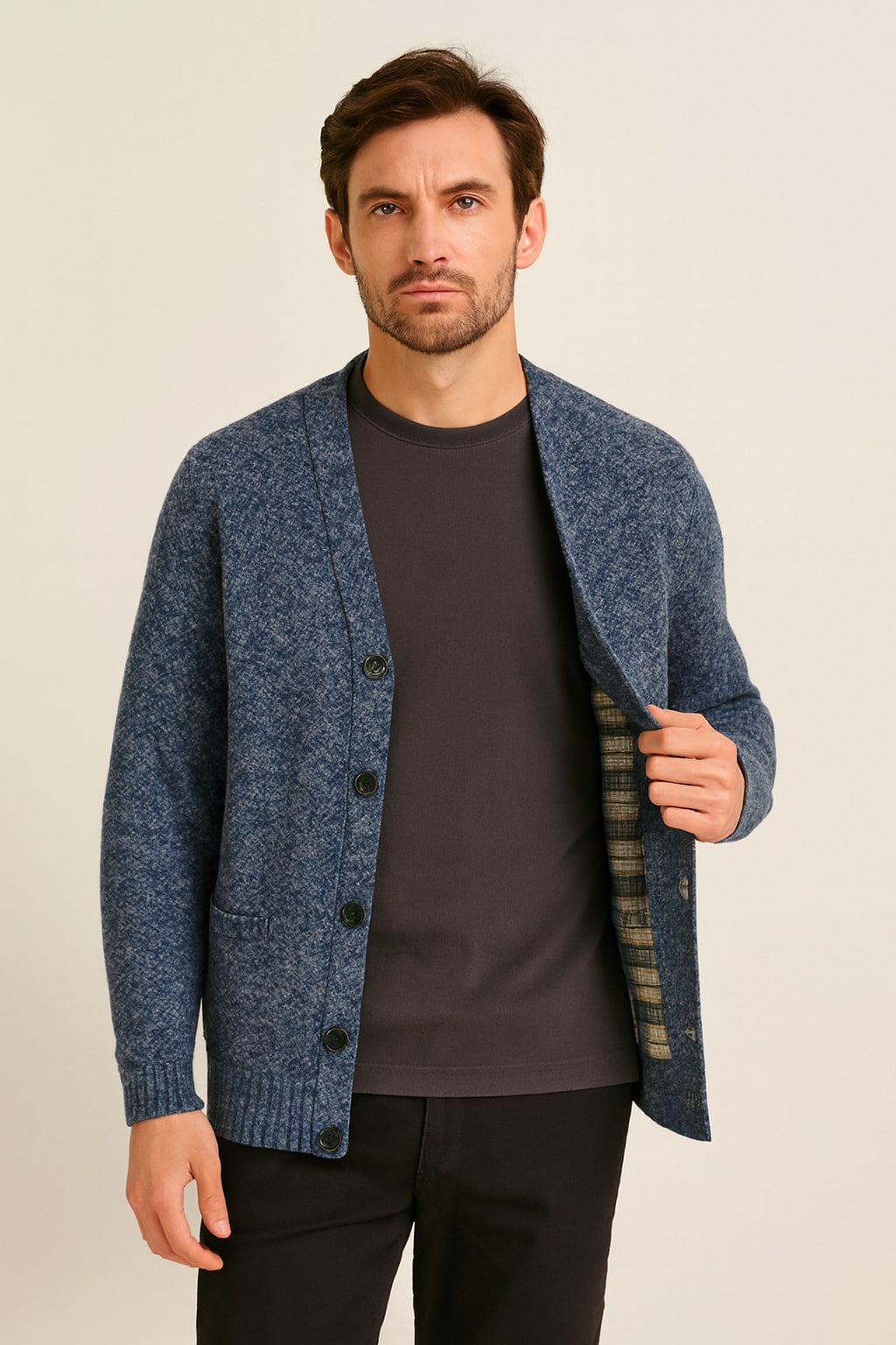 Men's Button Up Cardigan in blue grey, textured cotton-feel knit, worn open to show the tartan-check lining