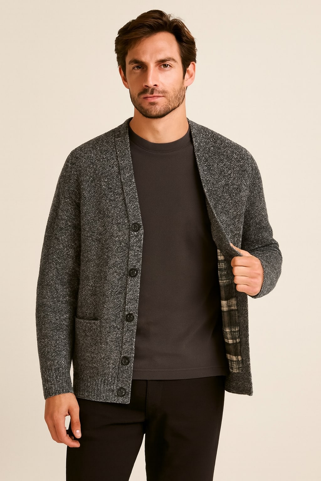 Men's Button Up Cardigan in dark grey, textured cotton-feel knit, worn open to show the tartan-check lining