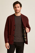 Men's Button Up Cardigan in red, textured cotton-feel knit, worn open to show the tartan-check lining