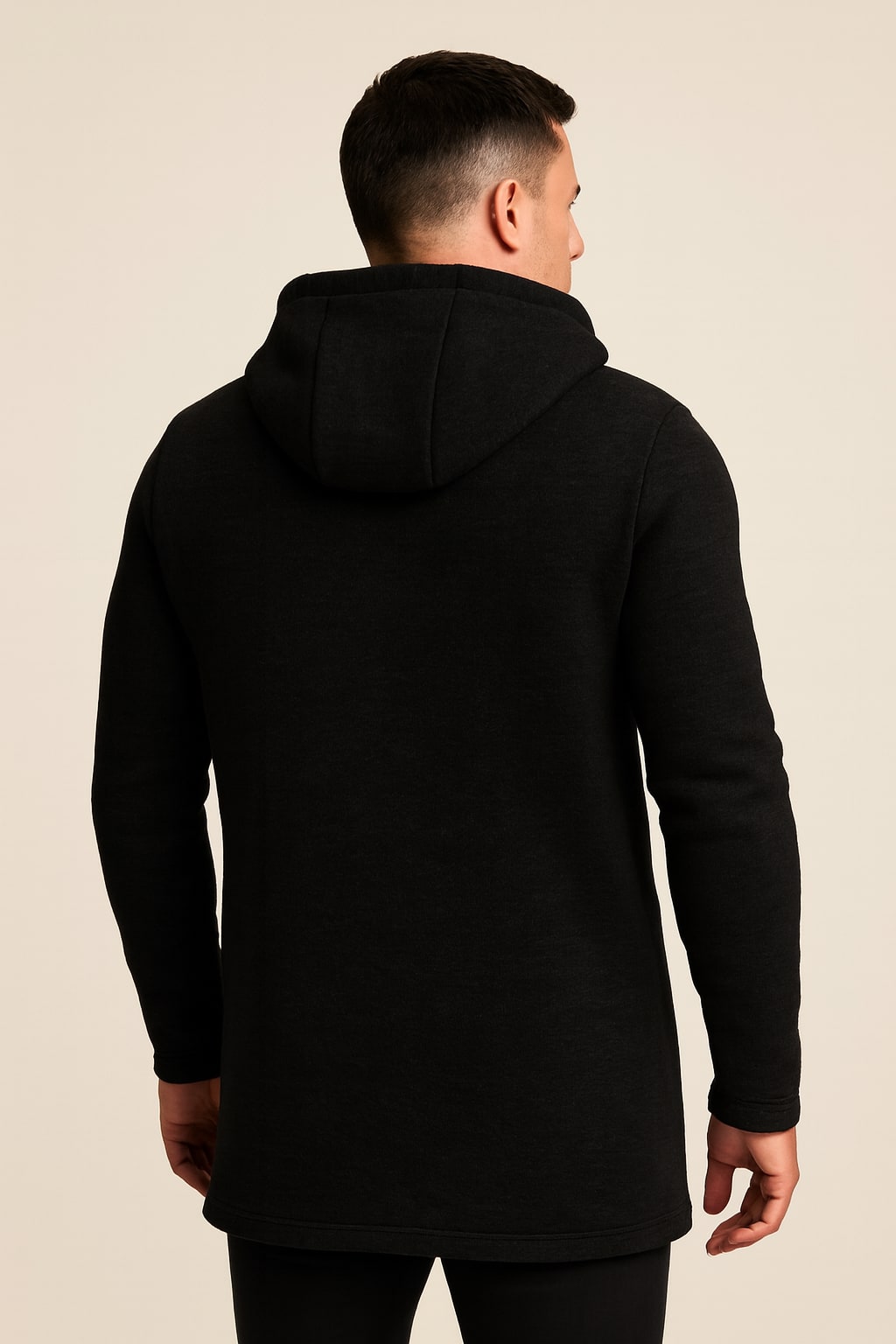 Back view of the men's fleece-lined hooded jacket in black on a model
