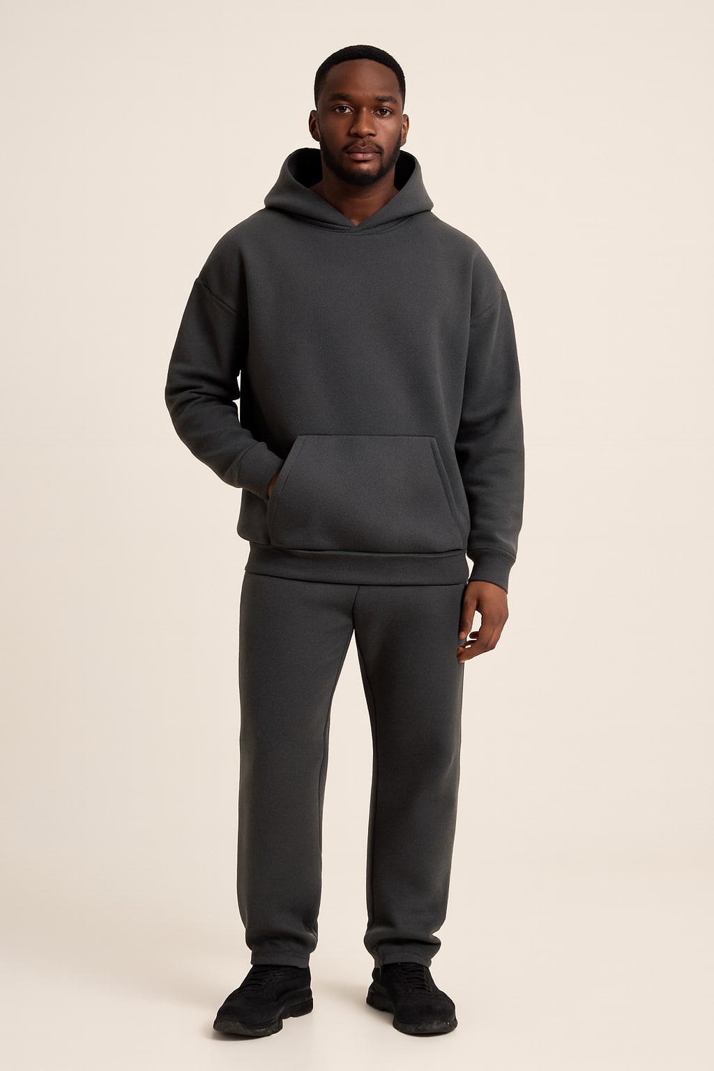 Men's Fleece Tracksuit in grey, oversized hoodie and joggers, front view on a model