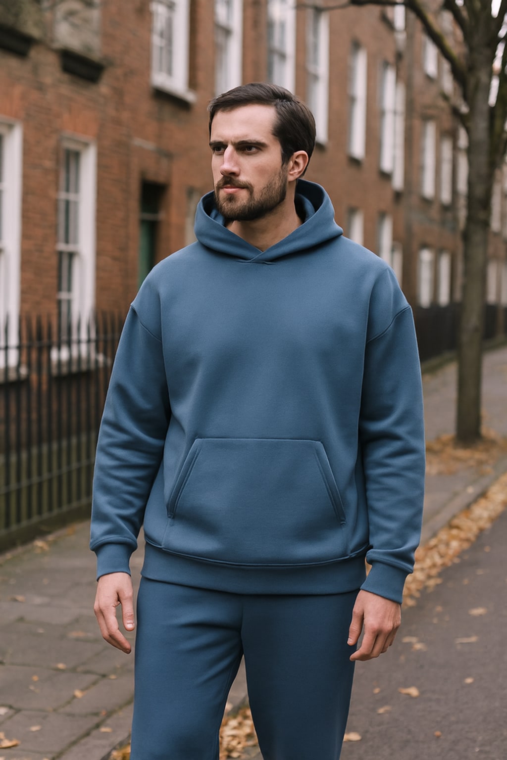 Man wearing the men's fleece tracksuit on an autumn street