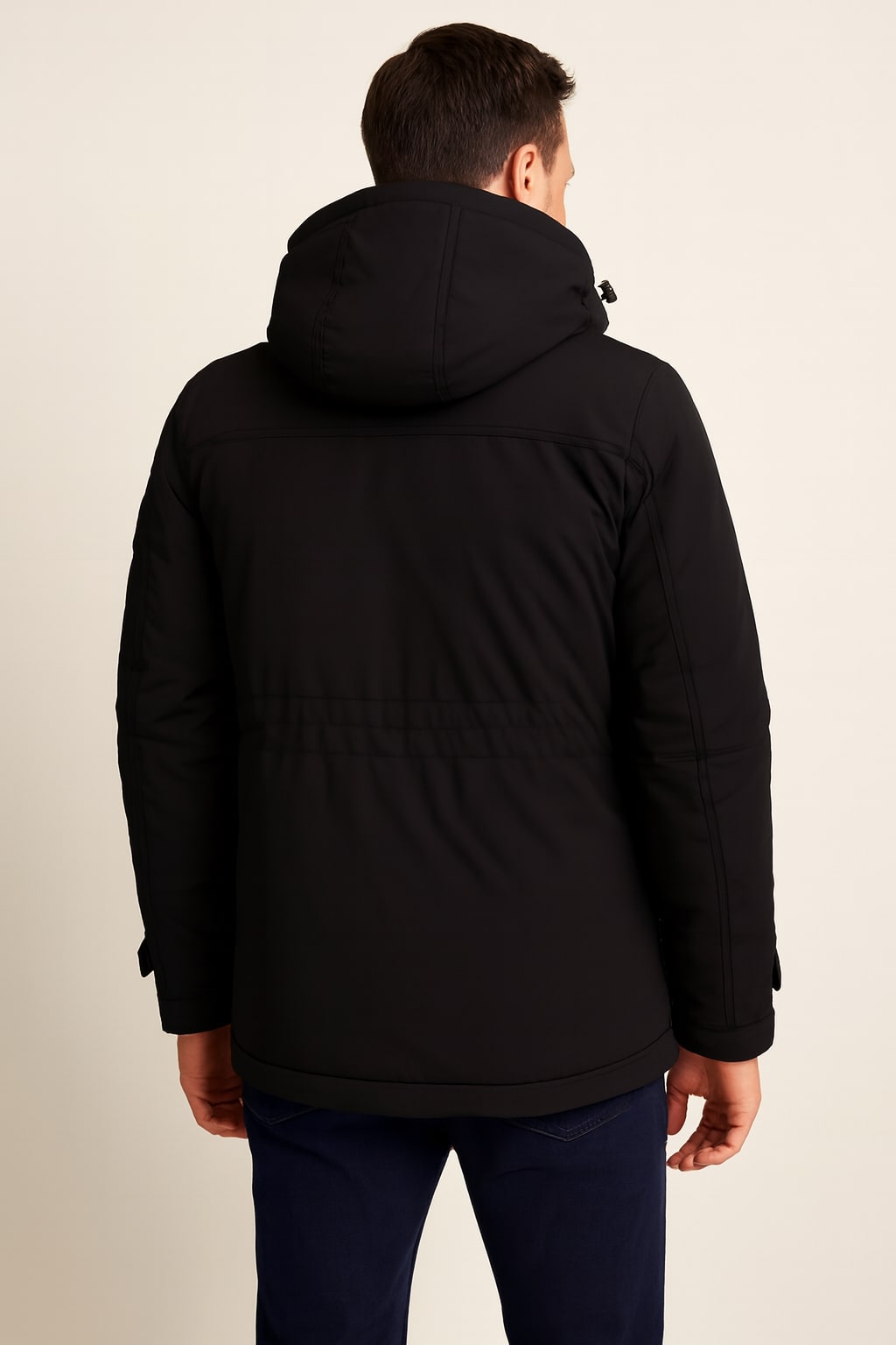 Back view of the men's hooded parka jacket in black on a model