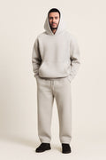 Men's Hooded Tracksuit in grey, oversized hoodie and wide joggers, front view on a model