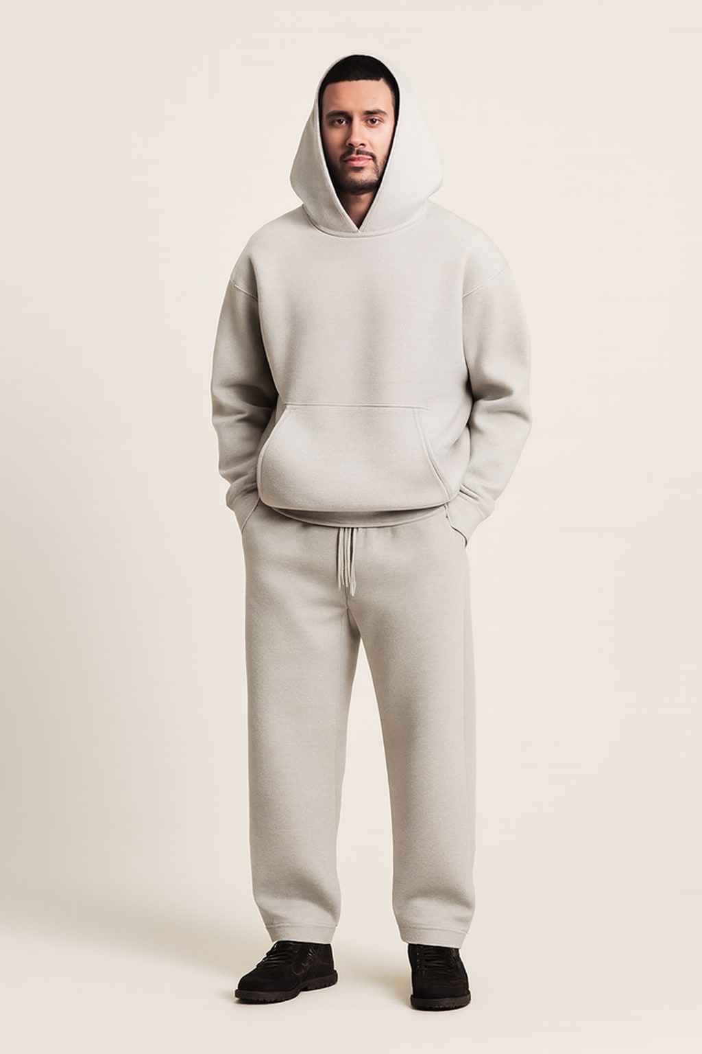 Men's Hooded Tracksuit in grey, oversized hoodie and wide joggers, front view on a model