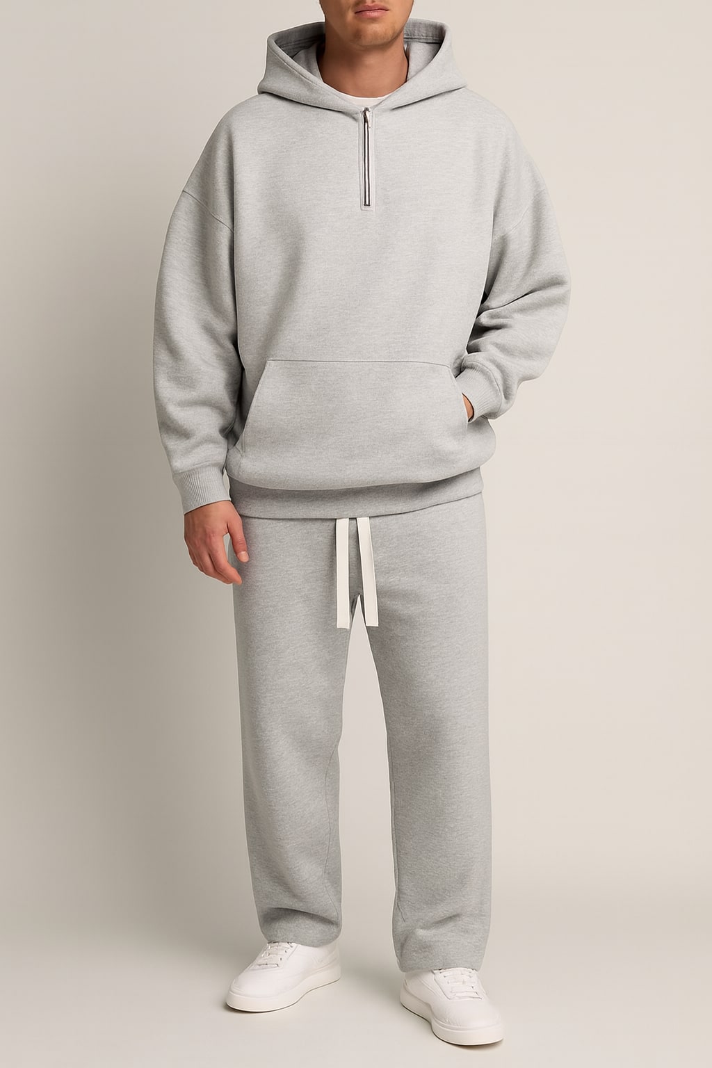 Men's Hoodie and Joggers Set in light grey, matching tracksuit, front view on a model