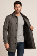 Men's Mac Coat in grey, quilted-lined button-front car coat, worn open to show the black diamond-quilted lining
