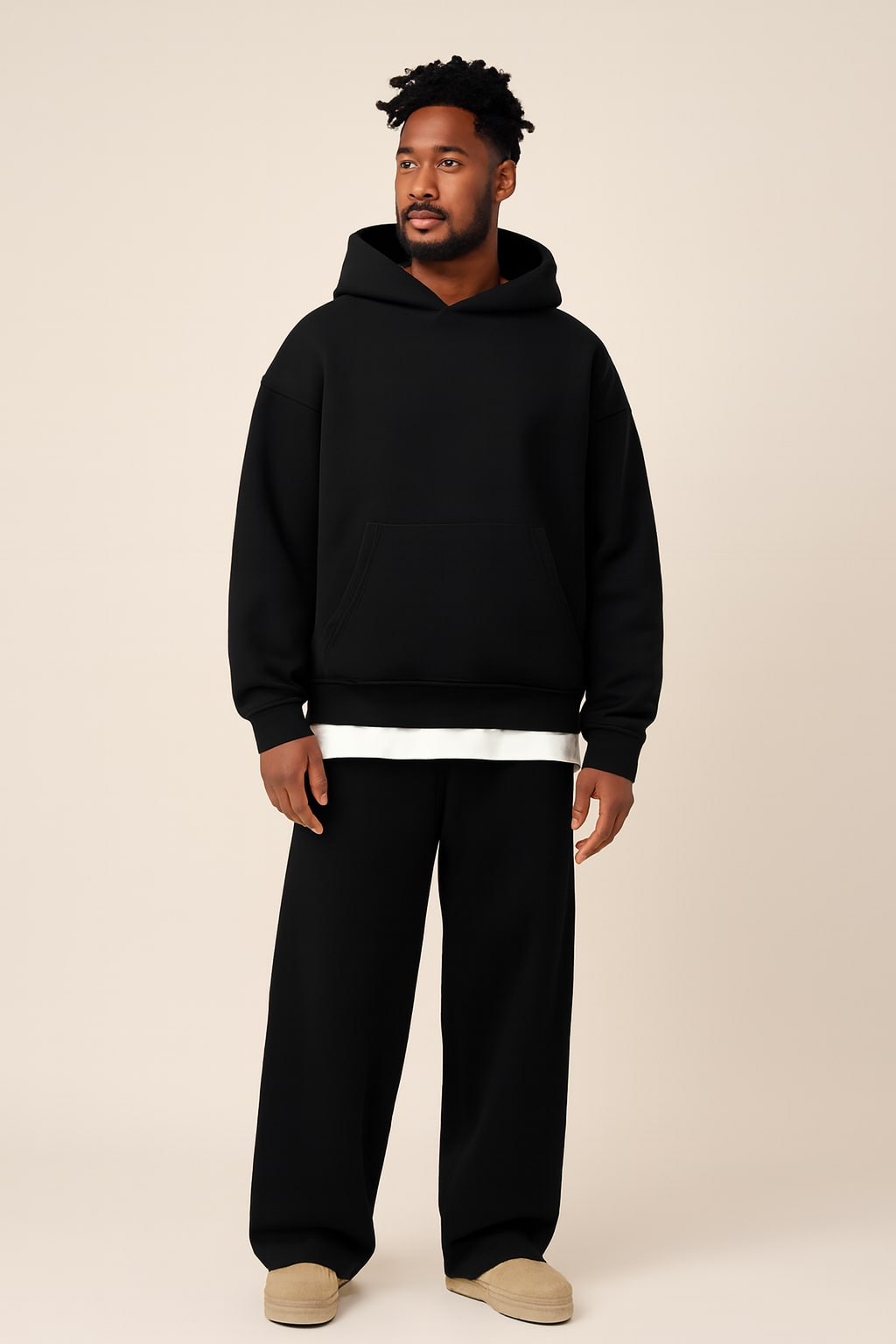 Men's Oversized Tracksuit in black, hoodie and jogger set, front view on a model