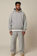 Men's Oversized Tracksuit in light grey, hoodie and jogger set, front view on a model