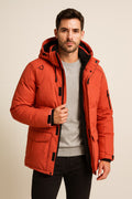 Men's Parka Jacket in orange, padded fleece-lined winter parka, worn open to show the black fleece lining