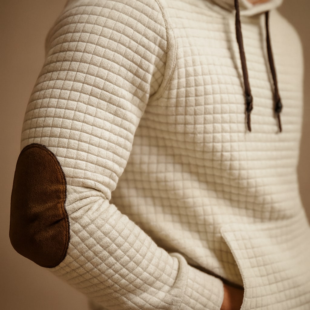 Close-up of the men's pullover hoodie showing the waffle texture and elbow patch