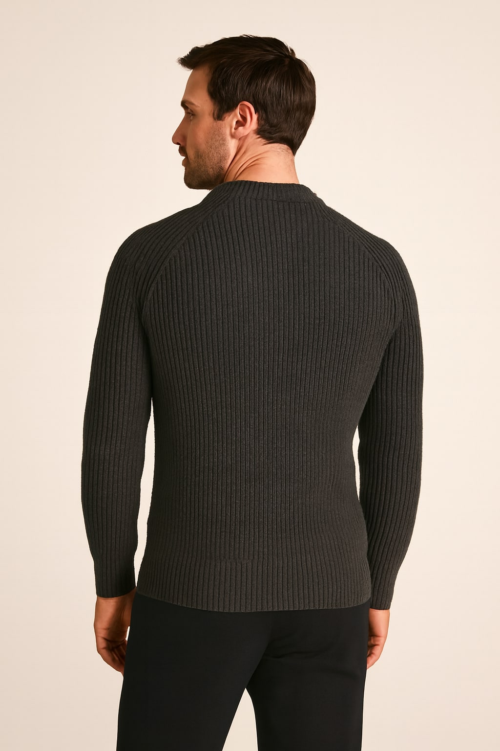 Back view of the men's ribbed jumper in dark grey on a model