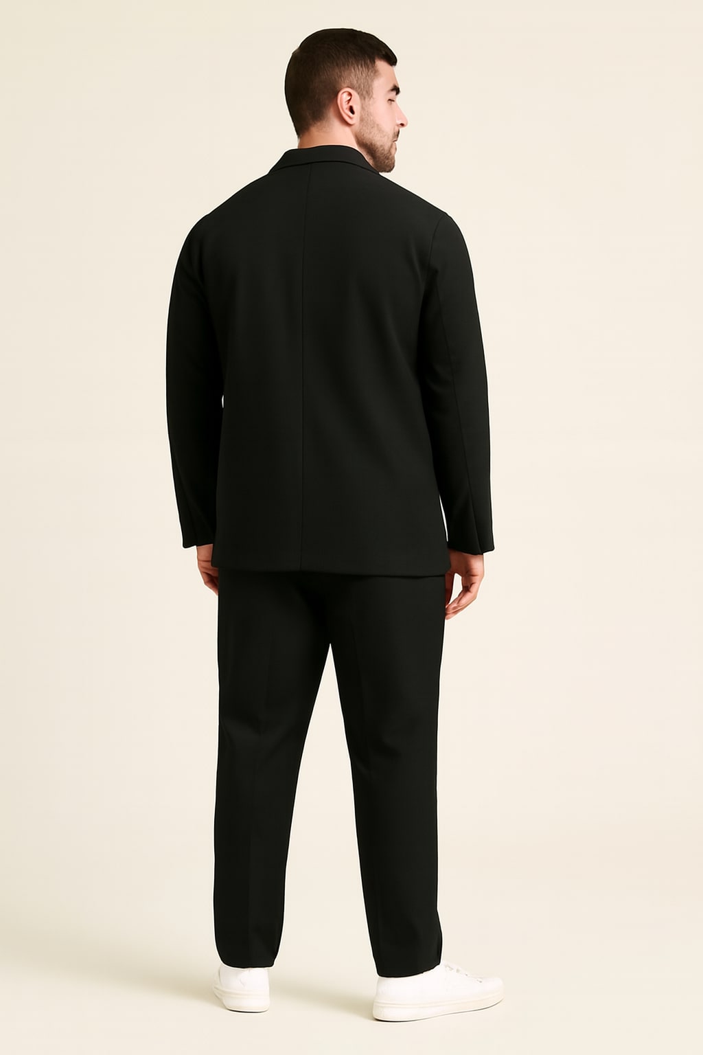 Back view of the men's two piece suit in black on a model