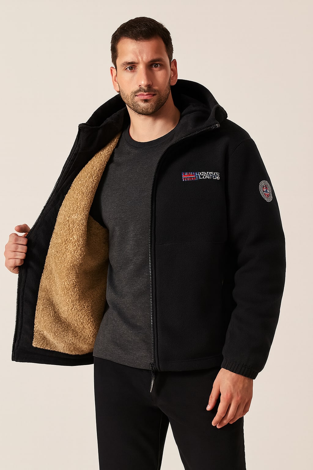 Men's Winter Jacket in black, insulated structured coat, worn open to show the beige sherpa lining